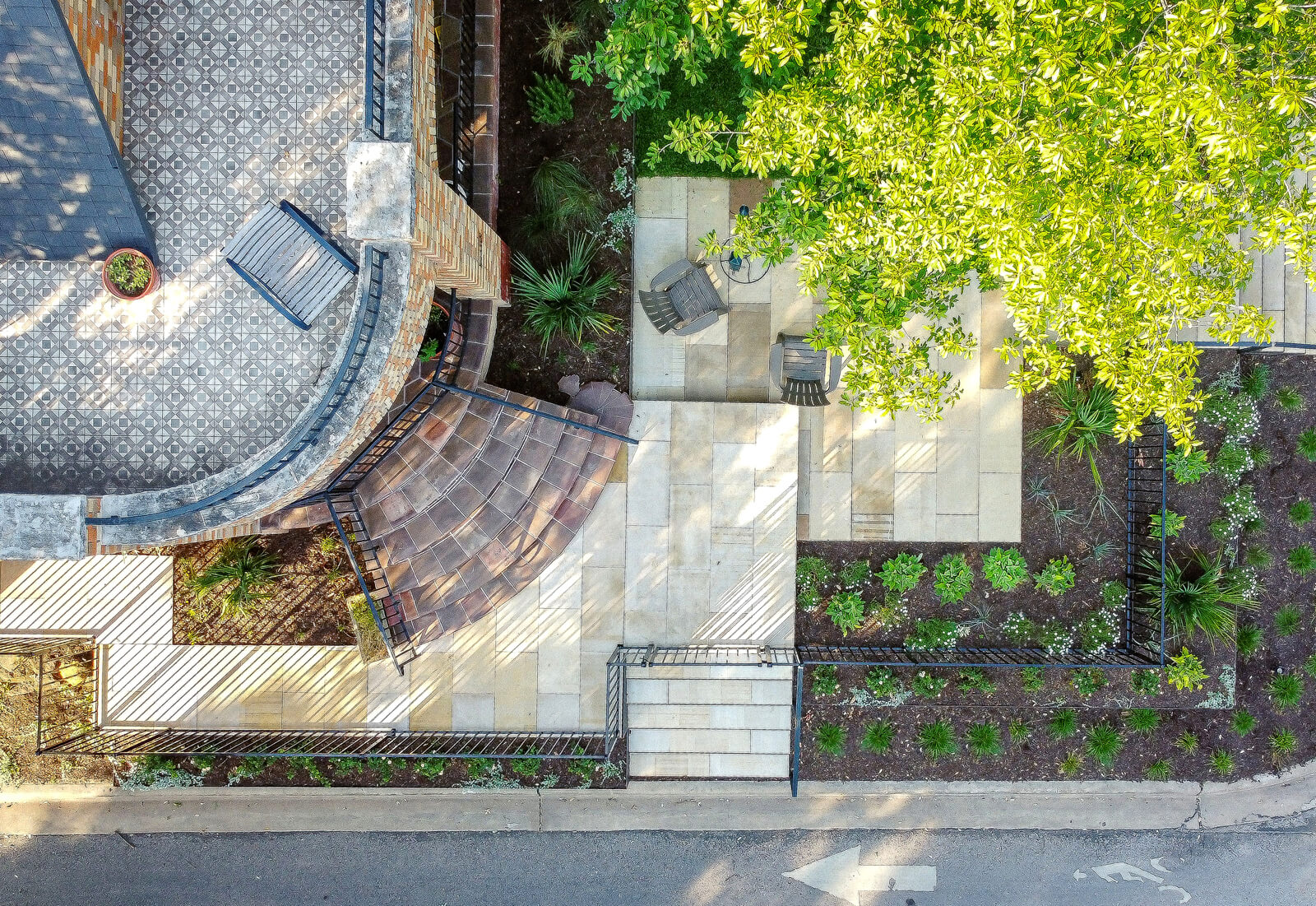 Landscape design featuring custom planters.